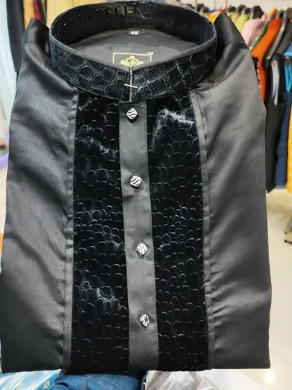 A close-up of my Nawab Poshak Kurta in jet black. This design features a unique crocodile-textured panel on the placket and collar, available in sizes up to 5XL.