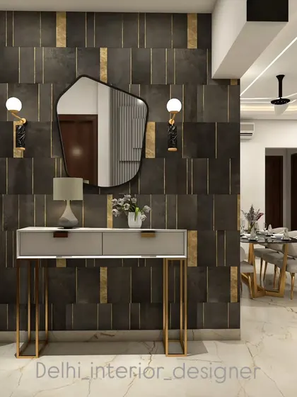 An entryway console concept. The design uses a dark, textured accent wall with brass inlays, a sleek console table, and an organic-shaped mirror to make a strong first impression.