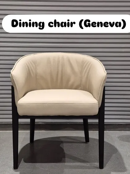 A frontal view of the beige 'Geneva' chair.