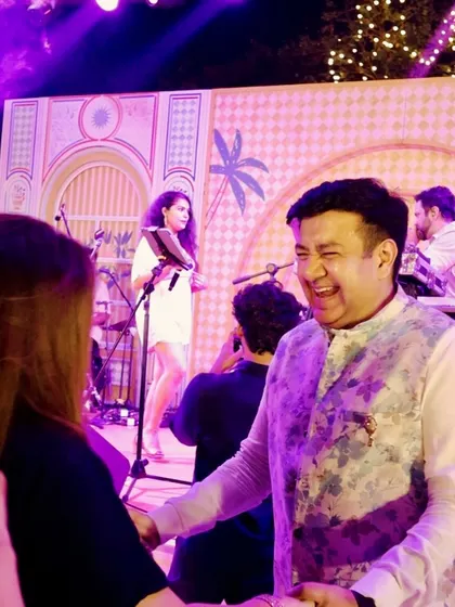 It's all about connection. We love interacting with the bride, groom, and their families, making them feel like part of the show. Here's a guest having a great time right by the stage.
