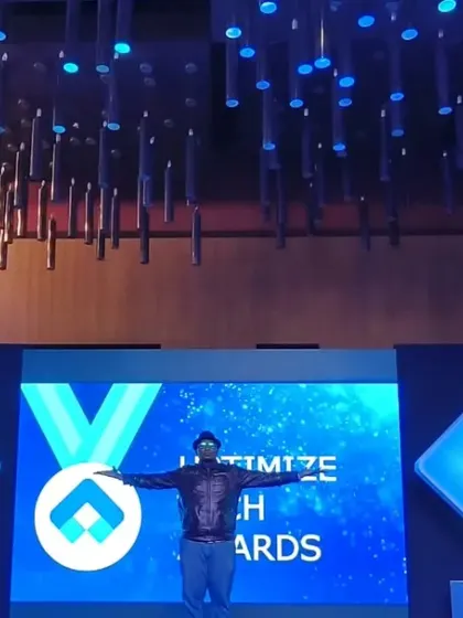 On stage at the Uptimeize Awards for Merck. The professional stage and screen setup is perfect for corporate awards and recognition events.