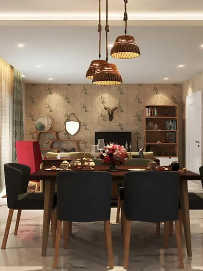A vintage-inspired dining room with beautiful patterned wallpaper and rustic pendant lights. The dark wood furniture and cozy armchair create a warm and inviting atmosphere.