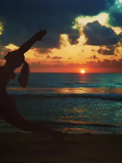 Every sunset brings the promise of a new dawn. A moment of peace in Reverse Warrior pose on the beach, resetting and realigning with the rhythm of the waves.