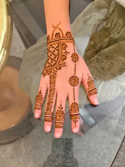 A detailed look at the elegant back-hand design created for one of the young girls.
