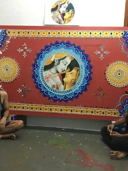 Our artists with a completed Radha-Krishna Lippan art panel. We take great pride in our handiwork and the final result of our detailed projects.