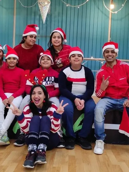 Our Christmas Eve session was full of festive cheer. Here's a group of our members dressed in red and wearing Santa hats.
