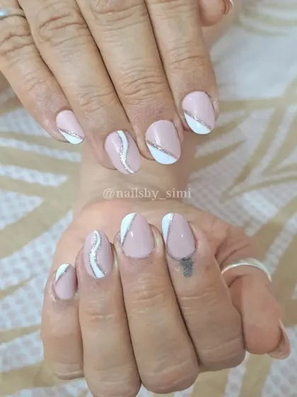 Simple yet beautiful baby pink nails with white and silver line details.