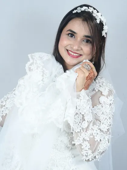 A blessed moment. This client looks absolutely angelic in one of my white lace wedding gowns.