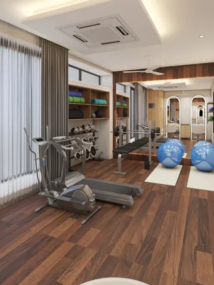 A concept for a spacious and well-equipped home gym with wooden flooring, ample storage for weights, and large windows for natural light.