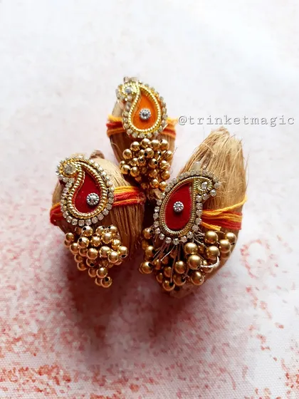 These decorative Nariyals (coconuts) are a traditional part of Rakhi gifting. Mine are decorated with beautiful paisley designs and beadwork to make them extra special.