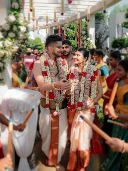 A beautiful moment between Varun and Priya as they are surrounded by dancers during their wedding procession. Their connection is clear even amidst the celebration.