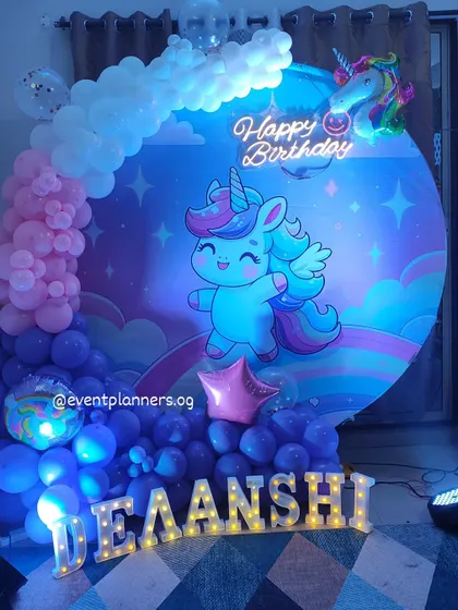 A slightly different angle of the dreamy unicorn birthday decor, highlighting the neon sign.