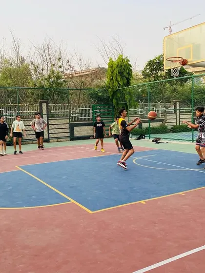 A player looks for an open pass while being closely guarded.
