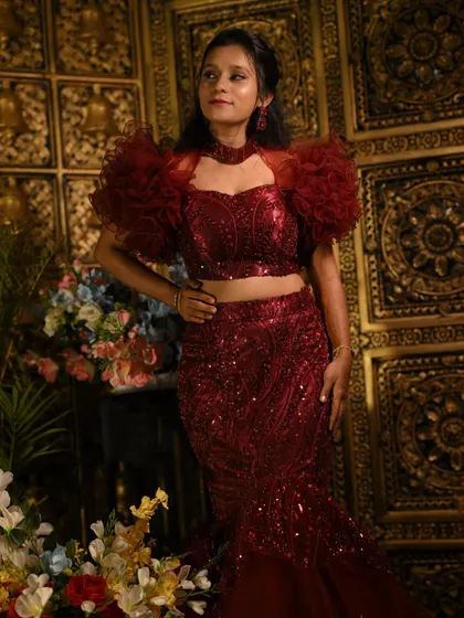 The intricate sequin work and ruffled sleeves make this outfit a true showstopper.