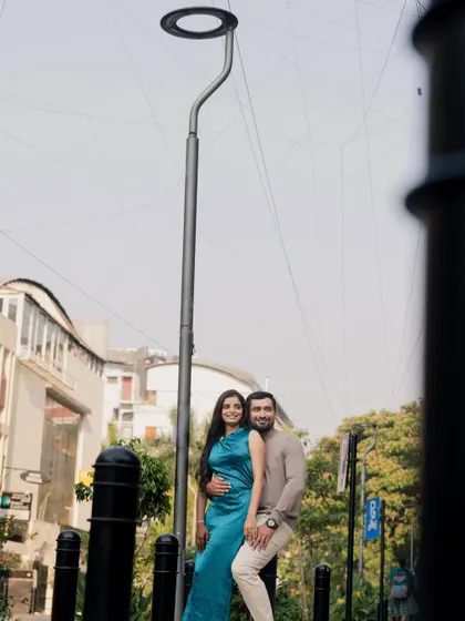 Using the strong vertical lines of the street and lamp post to frame the couple, this portrait has a unique, modern perspective that captures their stylish city vibe.