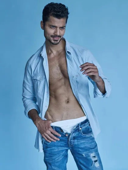 A playful and confident shot from a studio session, showing my personality and a well-defined physique.