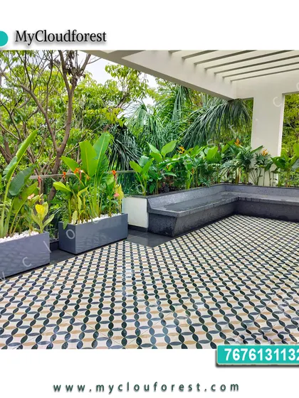 I used bold, patterned floor tiles to make a statement on this large terrace. The geometric design is balanced by minimalist grey planters filled with tropical plants and a built-in L-shaped bench, creating a sophisticated and contemporary outdoor living area.