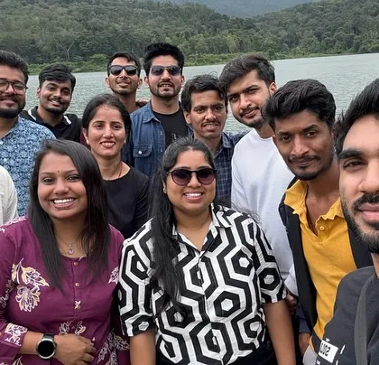 Making new friends by a serene lake in Chikmagalur. My trips are perfect for solo travelers looking to meet like-minded people.