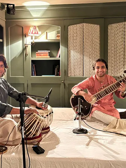 Performing at an intimate baithak at Soho House for an award-winning director. This is an example of a high-end private concert for a select audience.