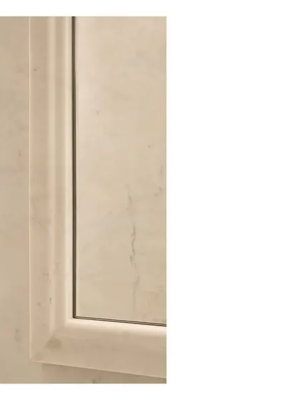 The big ideas and the minute detail must work together to tell the tale. This image shows the junction of Indian marble, aged brass, and salvaged teak, a palette of noble, natural materials.