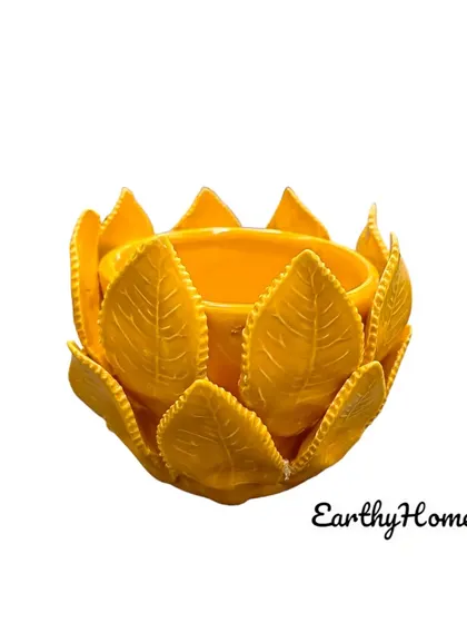 The same leaf-themed tealight holder in a vibrant yellow. It's perfect for adding a pop of color to your festive or everyday decor.