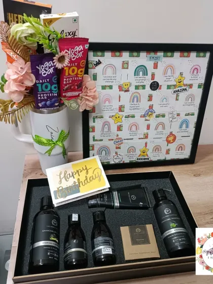 A birthday hamper for actor Zain Imam, featuring an affirmation quote frame, a personalized Stanley mug bouquet, and a grooming kit from The Man Company.