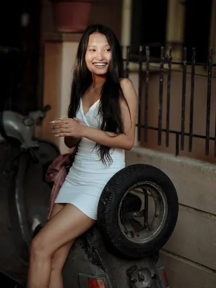 A fun, candid shot with a vintage scooter as a prop. Using props like this can add a lot of personality and a retro vibe to a lifestyle shoot.