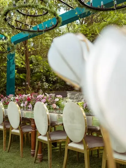 The full view of the outdoor reception area, showing the dining tables and lounge seating. The entire space was designed to feel open yet intimate.