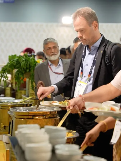 A guest helps himself to our hot buffet selection. We use high-quality chafing dishes and provide attentive service to ensure the food is always hot, fresh, and plentiful.