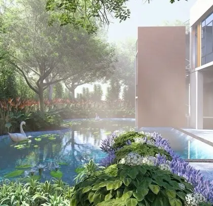 The backyard of this residence is a serene retreat, where the swimming pool transitions into a naturalistic pond with water lilies, surrounded by lush, layered planting.