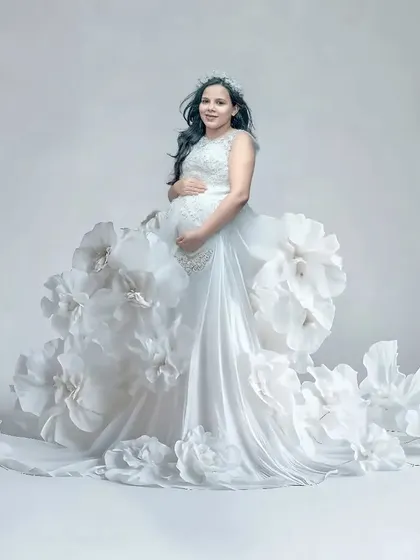 This is one of my most creative concepts, a gown made of giant paper flowers. This couture-style portrait is perfect for mothers who want a one-of-a-kind, high-fashion maternity photo.