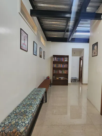 The corridor of our shala, with a small library and seating area. We believe the environment we practice in is just as important as the practice itself.