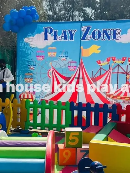 A close-up of the carnival-themed backdrop behind our rainbow play area.
