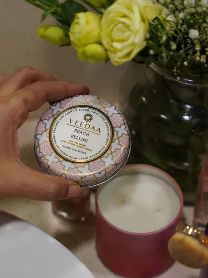 A closer look at our Peach Bellini tin candle. The vibrant packaging and sweet, sparkling scent make it a favorite for parties and celebrations.