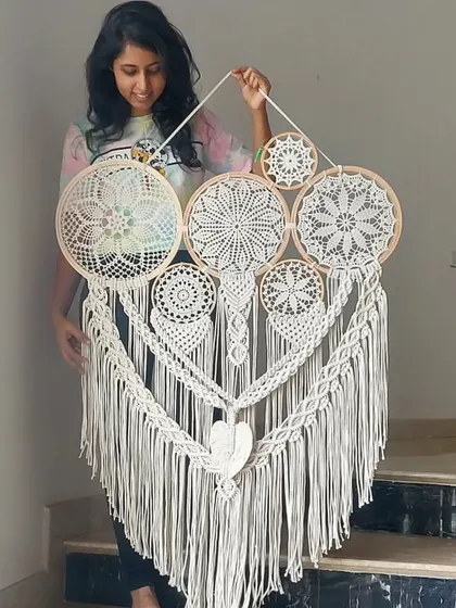 The beauty of macrame is in its versatility. We created this large, all-white cluster dreamcatcher to be a fusion of intricate artistry and bohemian charm, promising to infuse warmth and elegant style into any room it graces.
