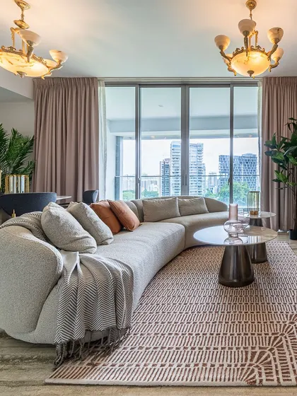 A beautifully styled living room showcasing the curved Poet Sofa, the sculptural Cone Round Coffee Tables, and the nature-inspired Tierra Sideboard. This space is a testament to how our diverse collections can be harmoniously blended to create a unique and luxurious home.