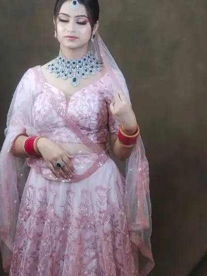 Another view of the pink lehenga with the statement American Diamond necklace. The V-shaped design of the necklace is very flattering.