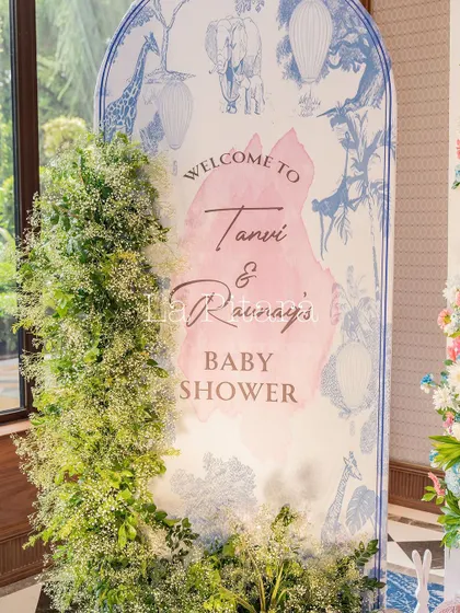 The main welcome sign, beautifully framed with a cascade of baby's breath flowers.