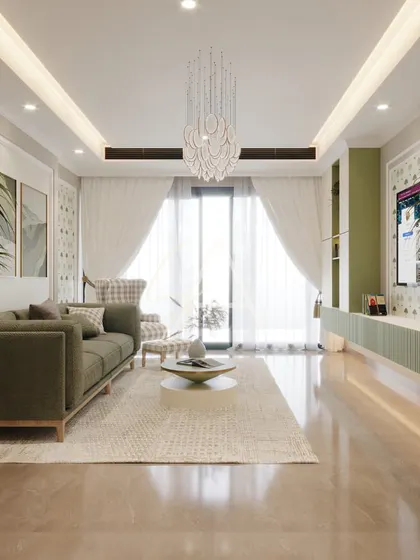 This living room uses a soothing palette of olive green and cream. The intricate chandelier and patterned wallpaper behind the TV add layers of detail and elegance to the comfortable space.