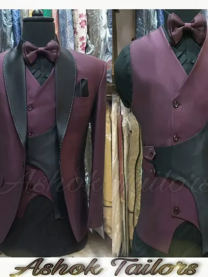 A unique designer suit in purple and black. The asymmetrical vest and contrasting fabrics create a bold, fashion-forward look for someone who dares to be different.
