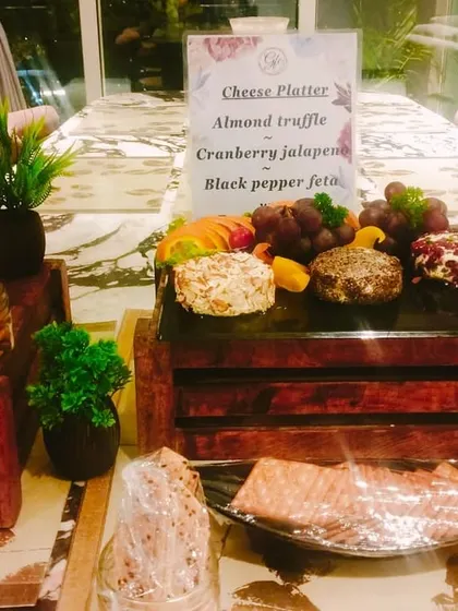 A cheesy affair. Our cheese platters feature a variety of our house-made cheese logs, including almond truffle, cranberry jalapeno, and black pepper feta.