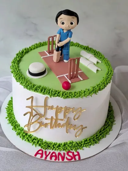 For the game that unites our nation. This cricket cake features a player at the pitch, surrounded by a grass-like buttercream border.
