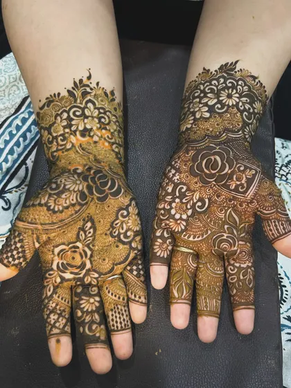 This design combines different floral styles on each hand. One is a classic rose pattern, while the other uses negative space for a modern feel.