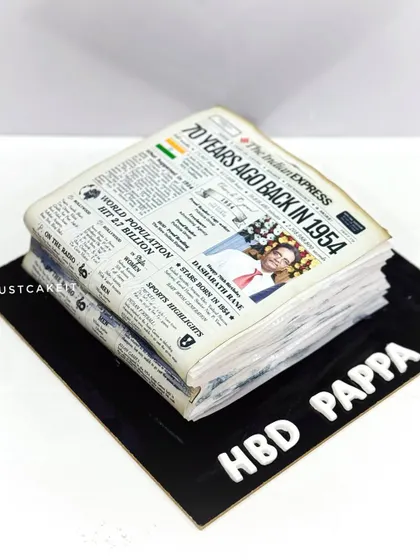 An all-edible cake designed to look like a vintage newspaper from 1954 for a 70th birthday. This was for a former copywriter head at 'The Indian Express'.