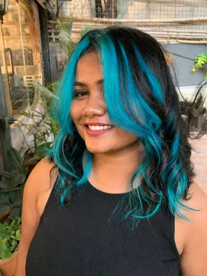 A happy client with her new turquoise gem hair. The color is so fun and edgy. (No filter)