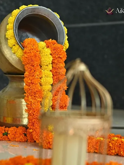 A classic decor detail, the overflowing pot of marigolds is a timeless symbol of prosperity and celebration in Indian culture.