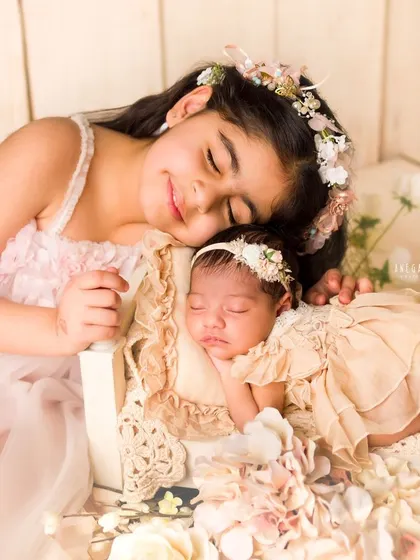 The beginning of a lifelong friendship. There is nothing sweeter than watching an older sibling meet their new baby sister. I gently guide these interactions to capture tender moments of love and protection.