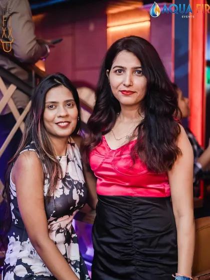 A stylish pair enjoying the party, showcasing the diverse fashion at my events.