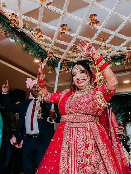 The pure excitement on the bride's face as she walks towards her forever, under a beautiful 'phoolon ki chadar'.