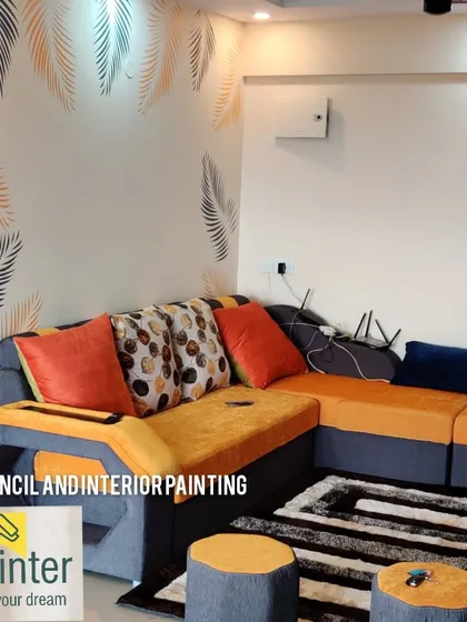 We used a leaf stencil design in shades of orange and grey to elegantly frame the corner of this living room. This technique is a great way to add a decorative touch without covering the entire wall.